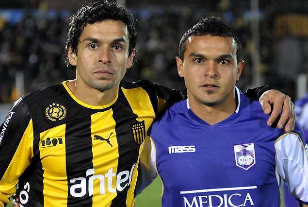 Los hermanos Amado: Miguel en los aurinegros, y Juan Carlos en los violetas. 